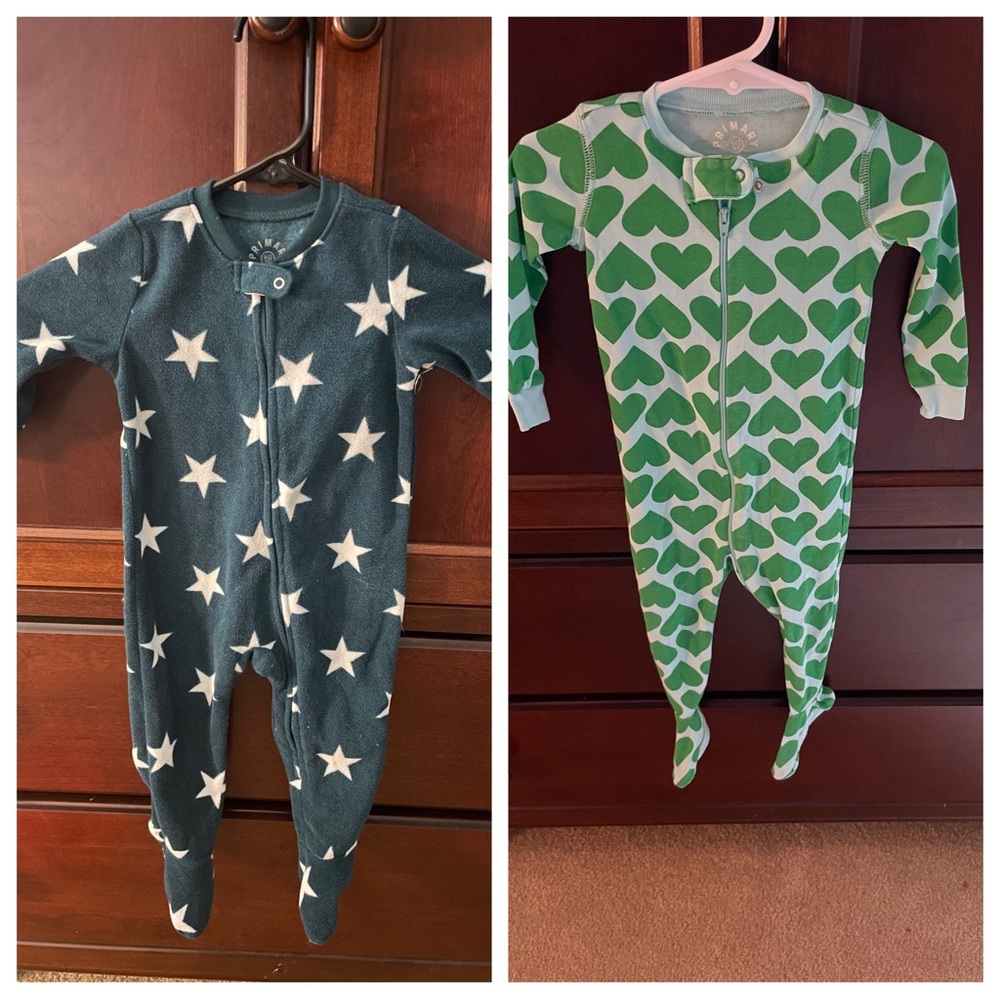 Two primary zip footed sleepers